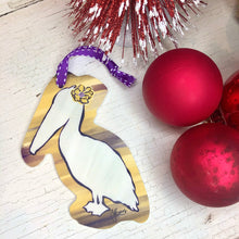 Load image into Gallery viewer, Purple and Gold Pelican Ornament
